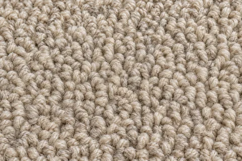Close view of wool carpet fibres in natural light