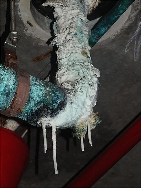 Massive limescale buildup on a water pipe